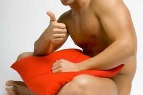 A man is preparing for jelq - an exercise for penis enlargement